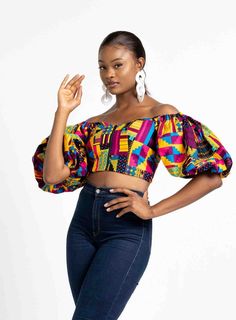 Description * African print puff sleeve crop top * Lined * Overall length about 10 inches * Elastic on the shoulder  * Zipper on the front * 100% Cotton * Made in Nigeria * Pant sold separately** Matching ALISA African Print Wide Leg Pants products/alisa-african-print-womens-pant] available Complete your look with the Sasha Choker Necklace [https://] or the ANICA Earrings [https://] or one of the gorgeous accessories from our Necklaces & Earrings collection [https://]. Fit: Regular fit, Perfect African Tops For Women, Ankara Blouse, African Blouses, Print Shirts Women, African Tops, African Print Tops, Puff Sleeve Crop Top, Printed Wide Leg Pants, African Fashion Women