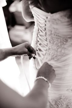 a woman is working on a wedding dress with her cell phone and the caption reads, it's faster and more fun