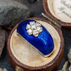 This fabulous vintage blue enamel ring features a deep blue enameled top that is accented with a cluster of sparkling diamonds. The ring is currently a size 6.5 and due to the design, it cannot be resized. Enamel Rings, Aquamarine Jewelry, Enamel Ring, March Birth Stone, Sparkle Diamonds, Vintage Diamond, Round Brilliant Cut Diamond, High Quality Jewelry, Cultured Pearls