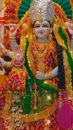 an idol is sitting on the floor in front of other decorations