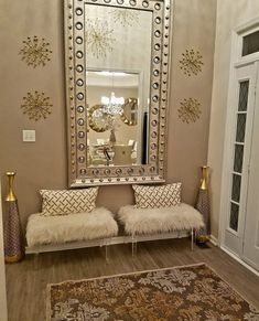 a living room filled with furniture and a large mirror