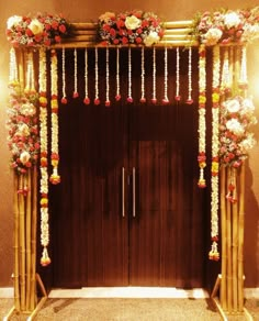 an entrance decorated with flowers and candles