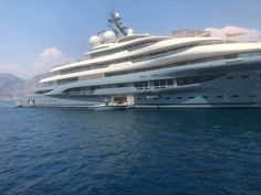 a large white boat floating on top of the ocean