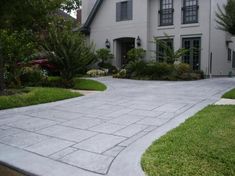 a large house with a driveway in front of it