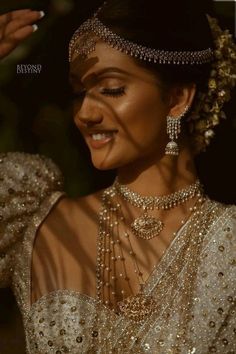 a woman in a bridal gown with jewelry on her head