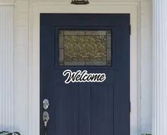 a blue door with the words welcome on it