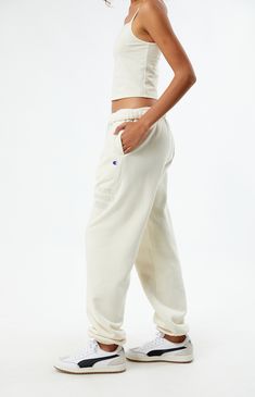 PacSun exclusive! Elevate your loungewear game with the Champion x PAC 1980 Sweatpants, designed for comfort and style. Featuring a high-rise fit with an interior drawstring waistband, side hand pockets, and elastic ankle cuffs, these sweatpants offer a cozy yet tailored look. Complete with a soft-touch PacSun graphic and iconic Champion logo C embroidery, they're the perfect blend of fashion and function for your everyday wardrobe.


	Solid color sweatpants
	High-rise
	Interior drawstring waistband
	Side hand pockets
	Champion C embroidery
	PacSun graphic
	Elastic ankle cuffs
	82% cotton, 18% polyester
	Machine washable
	Model is wearing a size medium
	Model measurements: 5’6” height, 30” bust, 25.5” waist, 36.5” hip High Waist Cotton Activewear For Loungewear, High Waist Cotton Joggers With Drawstring, High-waist Cotton Joggers With Drawstring, High Waist Drawstring Sweatpants For Leisure, Comfortable High Waist Sweatpants For Loungewear, Comfortable High-waist Sweatpants For Loungewear, Cotton High Waist Sweatpants With Drawstring, Sportswear Lounge Bottoms With Drawstring, Sportswear Loungewear Bottoms With Drawstring