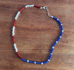 Feeling patriotic? this adjustable 16" adjustable necklace is for you!  Ideal for patriotic celebrations or everyday wear, this minimalistic flag design is handcrafted and made in America!   16 inches and adjustable, this necklace fits most. Adjustable Colorful Beaded Jewelry For 4th Of July, Adjustable Patriotic Jewelry For Independence Day, Patriotic Adjustable Jewelry For Independence Day, Adjustable Patriotic Necklaces As A Gift, Patriotic Round Beads Necklace As Gift, Adjustable Patriotic Jewelry With Colorful Beads, Blue Beaded Necklaces For 4th Of July, Patriotic Blue Beaded Necklace For Gift, Patriotic Blue Beaded Necklace For Gifts