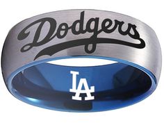 a los angeles dodgers ring with the word dodgers engraved on it's center band