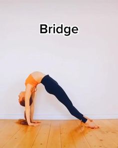 a woman doing a yoga pose in front of a wall with the words bridge on it