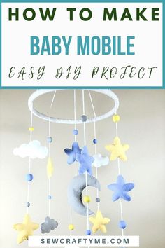 a baby mobile with stars and clouds hanging from it's side in the air