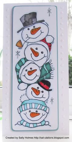 a card with snowmen and hats on it