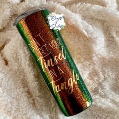 a green and gold glitter tumbler with the words, i hope you can't use a language on it