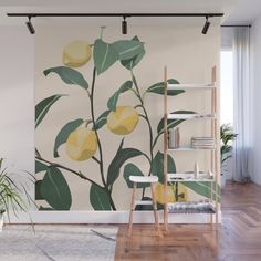 a wall mural with lemons and green leaves on it in a living room setting