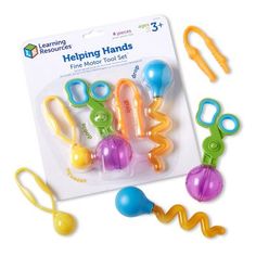 the learning resources helping hands fine motor tool set is packaged in its package and ready to be played with