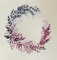 a watercolor painting of a wreath with purple and green leaves on white paper background