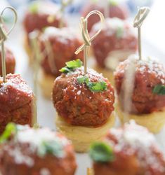 small meatballs with toothpicks on them are ready to be served for guests