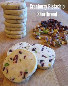 cranberry pistachio shortbread cookies on a cutting board