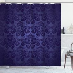 a blue shower curtain in a bathroom