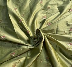 A beautiful Designer 100% Silk Taffeta Dupioni in the a gorgeous shade of Pistachio Green with pink and ivory floral embroidered vines that cascade down the face of the fabric in rows. Can be used for interior decorating, pillows, duvets, curtains, or dress and skirts garments as well as costumes. Sold by the yard. 55" Wide. Will combine shipping. Photo on the right is for inspirational purposes only, and is not made of the actual fabric being sold. We do not accept returns on fabric. We offer s Embroidery Vines, Decorating Pillows, Embroidered Vines, Silk Dupioni, Italian Garden, Pistachio Green, Silk Taffeta, Aesthetic Colors, Brocade Fabric