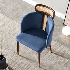 a blue chair sitting on top of a carpet covered floor