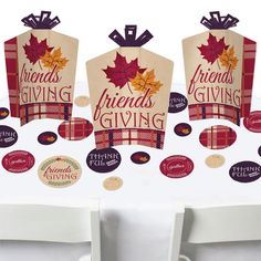 the table is set up with two wine bags and some stickers on it that say friends giving