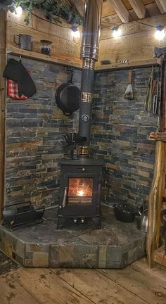 a wood burning stove sitting inside of a room