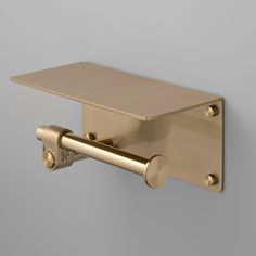 This toilet roll holder features a solid metal shelf and a hand-polished metal bar. It includes a cast solid metal knuckle and a spun metal end cap for added detail. Each piece is hand-crafted with a focus on both functionality and style. A perfect addition to elevate the look of your bathroom. Clean only with mild dish soap diluted in warm water. Cleaning chemicals may damage the finish. All finishes are subject to aging Returns of this product will be subject to a manufacturer restocking fee. Toilet Roll Holder With Shelf, Toilet Roll Holder Shelf, Buster Punch, Cleaning Chemicals, Toilet Roll Holder, Roll Holder, Screw Caps, Toilet Roll, Metal Shelves