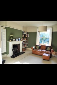 a living room filled with furniture and a fire place