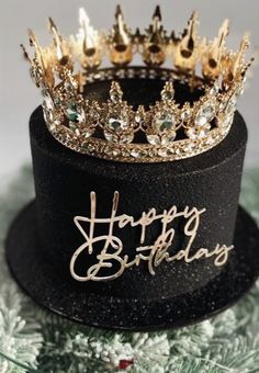 two crowns sitting on top of each other with happy birthday written on the crown's side