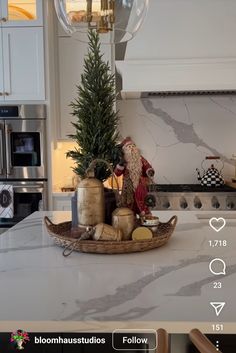 a christmas tree in a basket on top of a kitchen counter