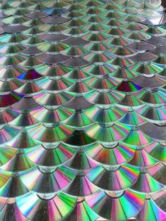 many different colored discs are stacked together