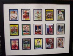 a framed baseball card display in a black frame