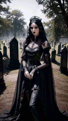 a woman dressed in gothic clothing sitting on a grave