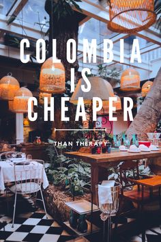 the words colombia is cheaper written over an image of tables and chairs in a restaurant