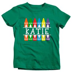 "Kids Personalized Back To School T Shirt Crayon Shirts Custom T Shirt Custom School Shirts Crayons This personalized birthday shirt is perfect for back to school! This design features colorful split crayons and will be personalized with your child's name. Make it easier for the teacher to remember your son or daughter's name this season with a personalized shirt! A great custom school shirt for elementary or pre-school aged children. TERMS FOR PERSONALIZED ITEMS: A proof will be provided to you Customizable Green T-shirt For Birthday, Fun Green T-shirt For School, Green Custom Print T-shirt For Birthday, Cute Green T-shirt With Custom Print, Fun Green T-shirt For Birthday, Green Fun Birthday T-shirt, Cute Green Tops With Name Print, Green Crew Neck Birthday Shirt, Green Tops With Name Print For Birthday