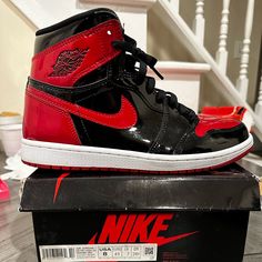 The Air Jordan 1 High Bred Patent Features Black And Red Patent Leather Upper With Signature Weaved Nike Air Tongue Labels. From There, A Classic Wings Logo On The Collar And A White With Red Air Sole Complete The Retro Design. Worn Once For Two Hours The Air Jordan 1 High Bred Patent Releases In December Of 2021 Jordan Red, Wings Logo, Air Jordan 1 High, Jordan 1 High, Jordans For Men, Jordan 1 Retro High, Jordan 1 Retro, Air Jordan 1, Jordan Shoes