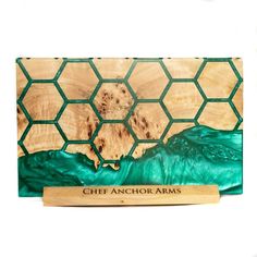 a wooden plaque with the words chef anchoramas on it and an ocean wave