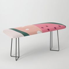 a watermelon bench with metal legs and a pink seat cover that has been designed to look like a slice of watermelon