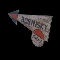 a wooden sign that says bodnesky there on it's side with an arrow pointing to the right