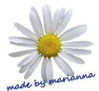 a white flower with the words made by marinana written below it