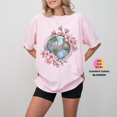 This Christian Women's Shirt features a beautiful pink floral aesthetic and an inspiring Bible verse. Made from Comfort Colors® fabric, it's a faith-based crewneck tee perfect for gifting or personal inspiration. It is perfect for travel and casual occasions. Handmade in the United States, this soft and comfy tee can be sized to fit or go two sizes up for a relaxed oversized look and feel.  Free Shipping for Orders $35.00 and Over  This program offers "free shipping" for items that are $35.00 an Spring Cotton T-shirt With Rose Print, Spring Rose Print Short Sleeve T-shirt, Spring Printed Pink T-shirt, Pink Floral Print Short Sleeve T-shirt, Casual Pink Floral Print Shirt, Pink Cotton T-shirt With Floral Print, Pink Floral Print Cotton T-shirt, Pink Floral Print Relaxed Fit Shirt, Casual Pink T-shirt With Rose Print