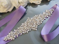 "Lavender Wedding Belt, Bridal Belt, Wedding Dress Belt, Wedding Sash, Rhinestone Belt, Crystal Belt, Prom Evening, Lilac Light Purple This is a beautiful bridal belt that will complement your dress in the most elegant way! Made with double faced silky satin or organza ribbon of great textile quality. Pleasant to eye and soft to touch. The color is wholesome and saturated. The jewel includes rhinestones and pearls of different sizes, white colored. Together, the satin/organza and the jewel creat White And Purple Wedding Dress, Light Purple Wedding, Belt Wedding Dress, Purple Wedding Dress, Purple Belt, Purple Accessories, Hand Beaded Embroidery, Wedding Belt, Wedding Dress Belt