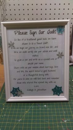 a white frame with a poem written in it on top of a green cutting board