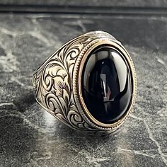 Men's Black Onyx Stone Silver Ring , Handmade Silver Ring , Oval Cut Ring , Engraving Floral Jewelery , Ottoman Men Ring , Gift for Him , Same Day For Shipping ✧ Product Details * Handmade İtem * Gender : Male / Female * Material : 925K Sterling Silver * Ring Weight : 13 Grams * Gemstone Type : Black Onyx ✔ Usage Details * Silver jewelry is very sensitive to chemicals. It is recommended to keep away from chemical substances such as cream, bleach, deodorant, detergent. * Silver jewelry can also darken quickly in salt water, that is, in sea water. For this reason, it is best to remove them when swimming in the sea. ✔ Shipping * Your orders placed on weekdays are delivered to the cargo on the same day. Your orders placed on the weekend are delivered to the cargo on Monday. ✔ Other Details * O Black Oval Rings With Intricate Design, Black Oval Ring With Intricate Design, Black Engraved Ring With Intricate Design, Black Oval Engraved Hallmarked Ring, Handmade Oval Signet Ring For Formal Occasions, Oval Handmade Formal Signet Ring, Ring Engraving, Oval Cut Ring, Handmade Silver Ring