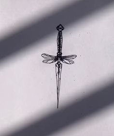 a black and white drawing of a dragonfly