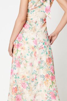 Elegant halterneck midi dress crafted from satin fabric Feminine floral print in a soft ivory hue with pops of pink and blue Cross-over front bodice with a flattering V-neckline Sleeveless design with a fitted bodice and flared skirt Concealed back zip closure for a seamless finish Exuding romantic charm, this floral midi dress is perfect for special occasions like weddings, garden parties, or summer soirées. The cross-over bodice and halterneck silhouette create a flattering hourglass shape, while the satin fabric drapes beautifully. Style it with strappy heels and a clutch for a refined, feminine look that radiates elegance and grace. Dresses Occasion, Midi Dress Elegant, Oasis Dress, Oasis Fashion, Blue Cross, Hourglass Shape, Garden Parties, Dress Crafts, Puff Sleeve Dresses