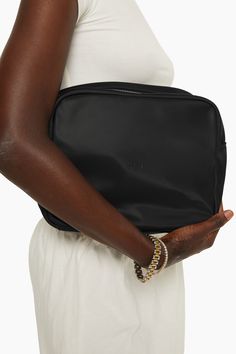 Stay organized with our Everything Bag in Onyx. This large pouch boasts an interior pocket and a zipper closure for added convenience. It's the ideal accessory for keeping your essentials in one place. Everyday Pouch With Laptop Sleeve, Everyday Laptop Sleeve Pouch, Black Travel Bag With Zipper Pouch, Black Zipper Pouch Bag For Travel, Versatile Black Cosmetic Bag For Travel, Black Travel Pouch With Zipper Pocket, Black Zipper Pouch Bag For On-the-go, Everyday Black Bags With Zipper Pouch, On-the-go Laptop Sleeve Pouch Bag