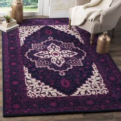 a purple rug with an ornate design on it