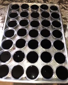 a metal pan filled with lots of black liquid